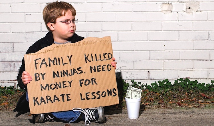A young boy collecting funds for karate lessons